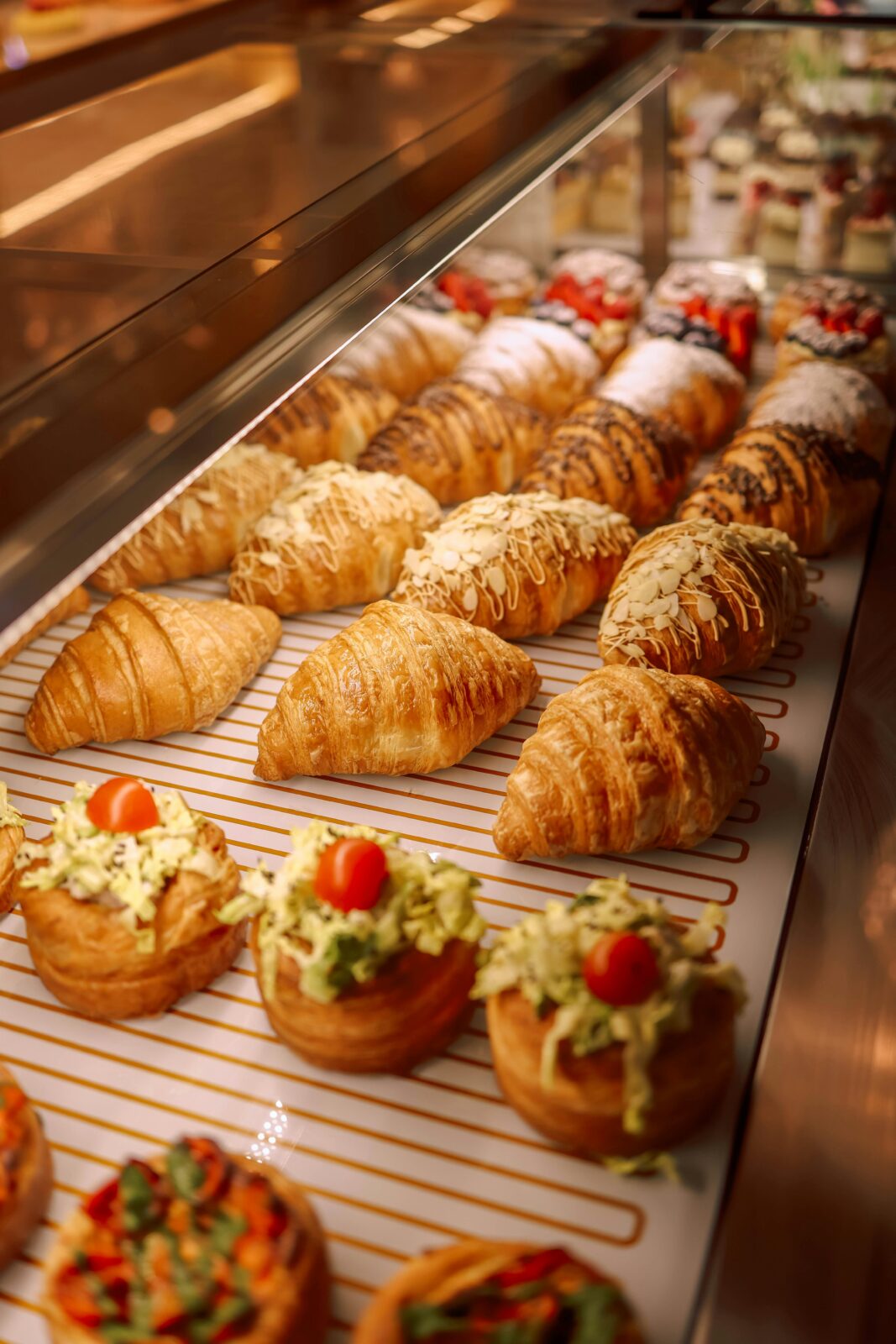 Indulge in freshly baked croissants and savory pastries in a bakery setting.